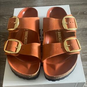 Birkenstock Bold Orange Sandals with Gold Accents